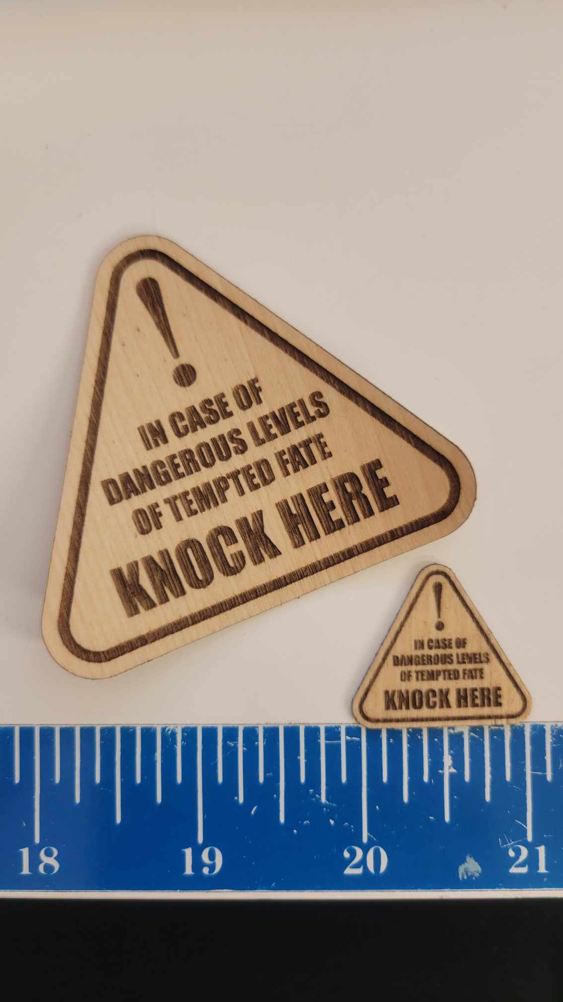 Triangular wood-look vinyl stickers by InkBird Print Studio, with bold exclamation marks, quirky warning text, and approx. 2 inch size. "knock on wood"