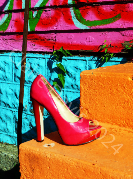 Pink Heel art print by Claire Davis features a bold pink stiletto on orange steps, vibrant graffiti wall backdrop; 8x10 inches.