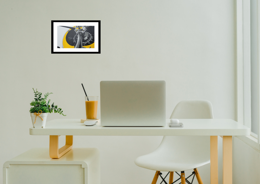 Claire Davis's sceren printed art:  TMB-3 Avenger 309 WWII airplane vinyl wall print in yellow, black, and gray on display above a white desk.