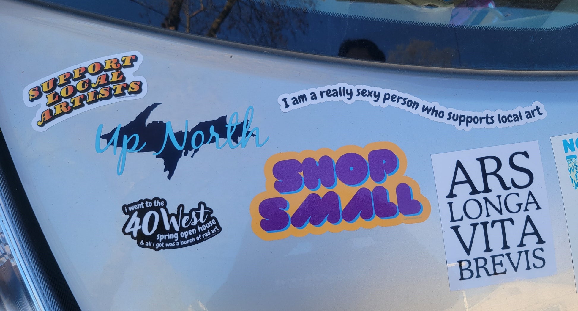 Set of six colorful vinyl Shop Small decals from InkBird Print Studio; weatherproof, crisp adhesive stickers with local art slogans.